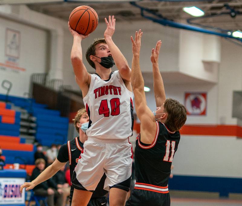 Timothy Christian's Ben VanderWal (40) shoots the ball in the post over Wheaton Warrenville South's Danny Healy