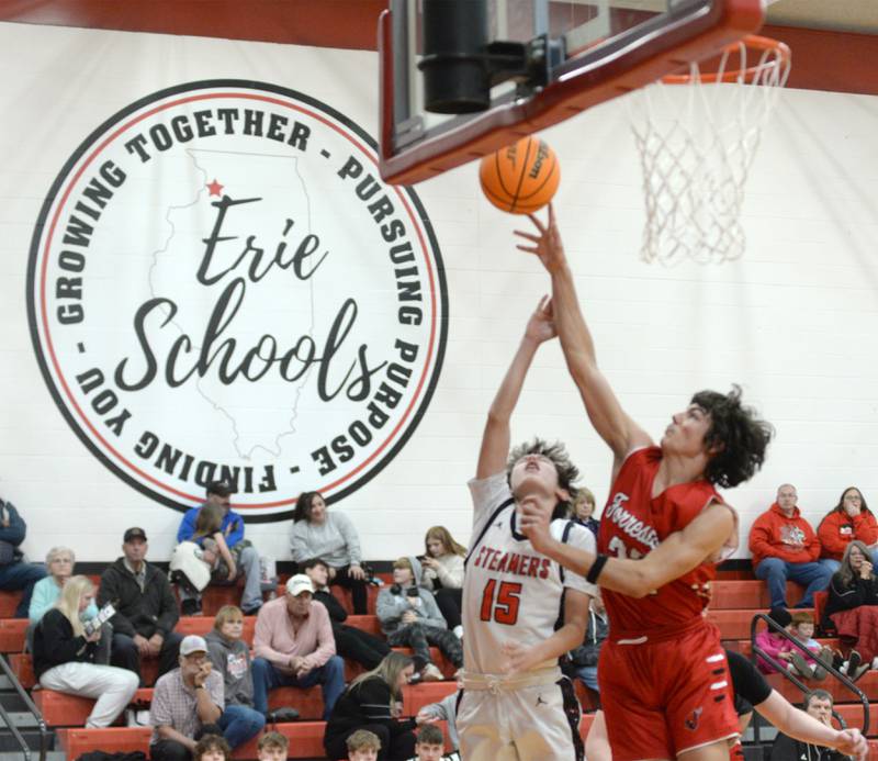 Forreston's Jonathan Milnes (32) gets a piece of a shot by Fulton's Owen VanZuiden (15) during a Friday, Dec. 27, 2024 game at the Cliff Warkins Memorial Basketball Tournament at Erie High School.
