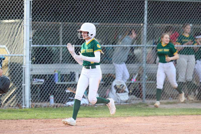 Grant Park's Kaylie Meherg applauds a grand slam by teammate Cheyenne Hayes as she approaches home plate during Grant Park's 12-2 victory over Milford/Cissna Park in six innings on Wednesday, March 25, 2026.