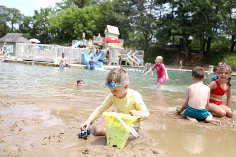 Mason LaFleur, 5, plays in the sand at the Batavia Park District’s Hall Quarry Beach on Thursday, June 13, 2024.