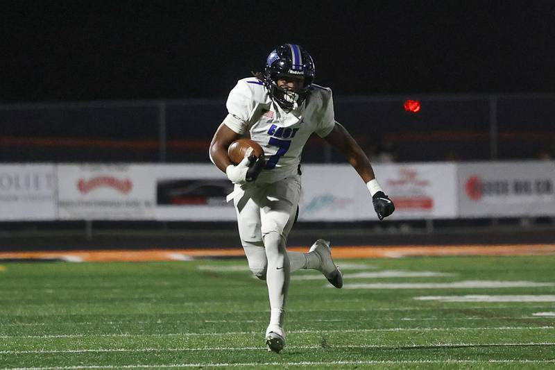Lincoln-Way East’s Zion Gist finds open field after a catch against Minooka on Friday, Nov. 8, 2024 in Minooka.