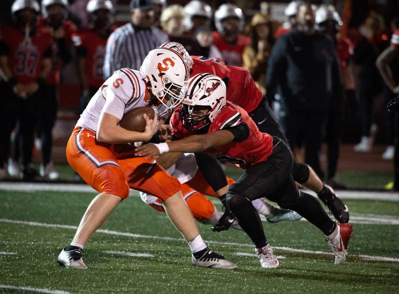 Bradley-Bourbonnais' Ty Thurmond, right, brings down Shepard's Billy Massey in a Class 6A playoff game on Friday, October 31, 2025.