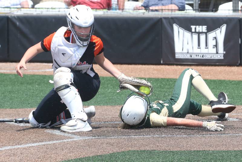 St. Bede's Emma Slingsby slides underneath the tag of Illini Bluffs catcher Lexi Brinkman in the Class 1A State championship game on Saturday, June 3, 2023 at the Louisville Slugger Sports Complex in Peoria.