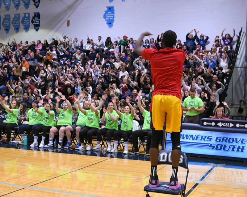 Harlem Wizards player pump up the crowed before the start of the game on Sunday Jan. 19, 2025, held at Downers Grove South High School.