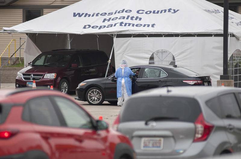 Cars line up at the Whiteside County Health Department in Rock Falls Oct. 25 for testing. Whiteside is one of 50 counties that will receive one of the first shipments of the COVID-19 vaccine in coming weeks.