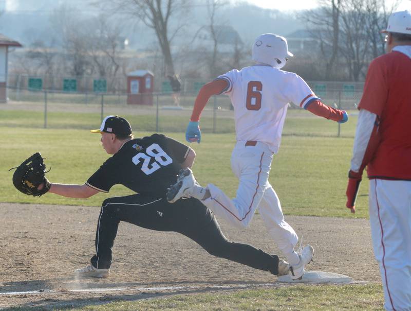 Harvard's Justin Wheeler squeezes the throw to first for an out against Oregon on Monday, March 23, 2026 at Oregon High School.