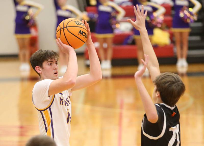 Mendota's Aden Tillman sinks a three-point basket over Kewanee's Griffin Hicks during the 50th annual Colmone Classic on Thursday, Dec. 12, 2024 at Hall High School.