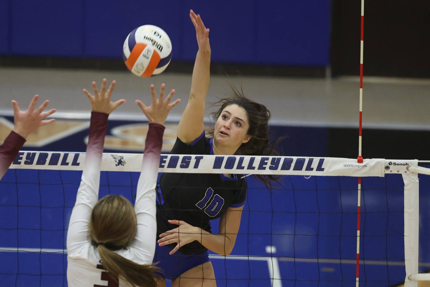 Lincoln-Way East’s Ava Nepkin hits a shot against Lockport.