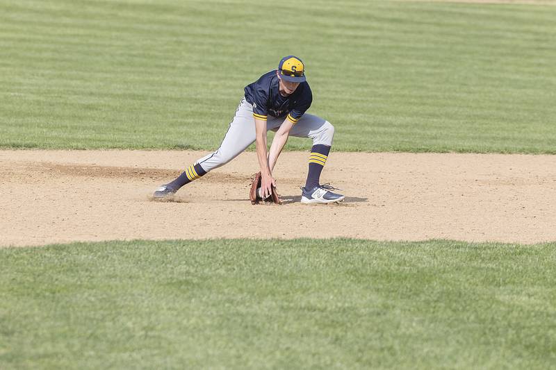 Sterling’s Trevor Dir scoops a ball at second base against Dixon Tuesday, May 16, 2023.