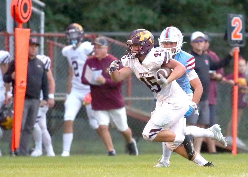Richmond-Burton’s Riley Shea sprints with the ball in varsity football at George Harding Field on the campus of Marian Central High School in Woodstock on Friday, August 29, 2025.