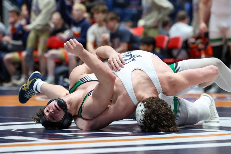 Providence Catholic's Brayden McKay resists a pin by IC Catholic's Brody Kelly in the 175-pound match during IC Catholic's victory in the IHSA Class 2A Dual Team State championship on Saturday, Feb. 28, 2026.