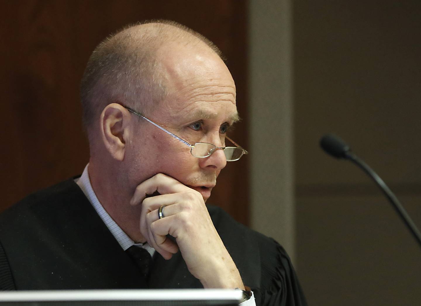 Judge Mark Gerhardt listens to an argument  Friday, Jan 28, 2022, during a motion hearing before at the McHenry County Courthouse on the state’s case against Michael M. Penkava and Collin B. Scott, both elders in a Crystal Lake Jehovah's Witness congregation, who are charged with misdemeanors for failing to report the sexual abuse of a child. Gerhardt listened to a motion on whether a congregant in the church can testify about what she told the two elders or whether that's covered by clergy-penitent privilege and inadmissible.