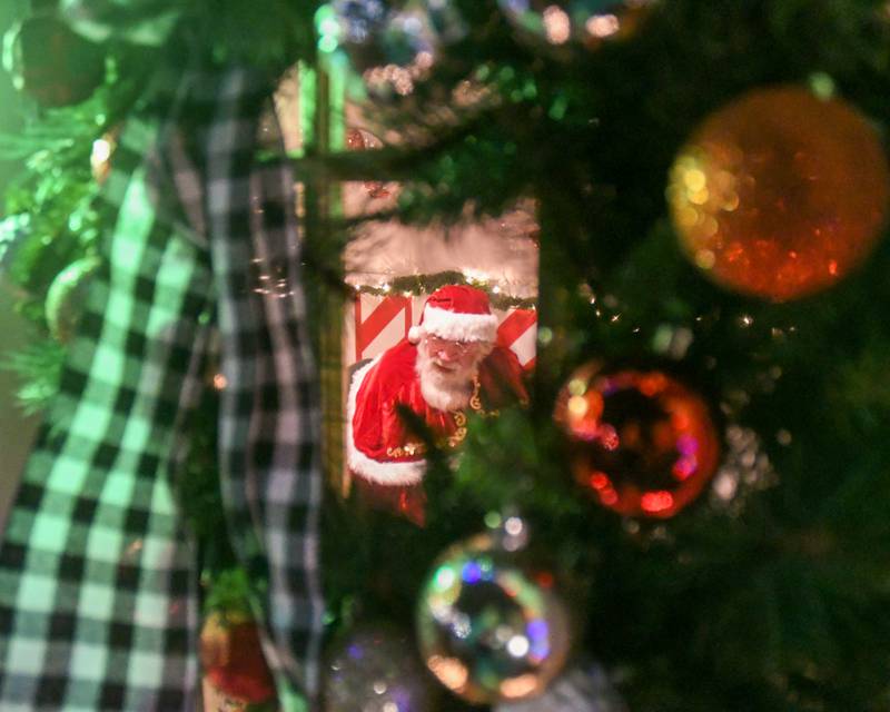 Santa Claus talks to community members at his home at Van Buer Plaza during the DeKalb Chamber of Commerce's annual Lights on Lincoln and Santa Comes to Town event held in downtown DeKalb on Thursday, Nov. 30, 2023.