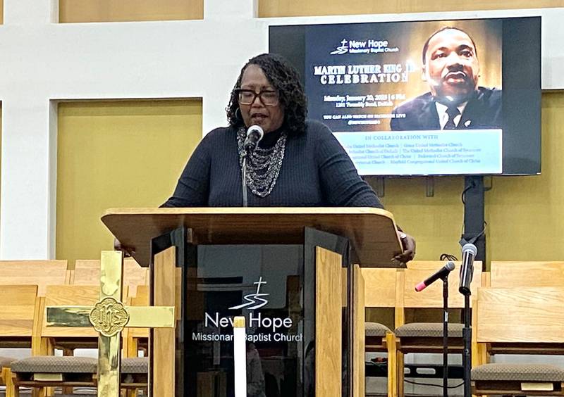 The Rev. Desiree Bailey, associate minister at New Hope Missionary Baptist Church, 1201 Twombly Road, DeKalb, leads the crowd in prayer during the annual Martin Luther King, Jr. Celebration event held on Monday, Jan. 20, 2025.