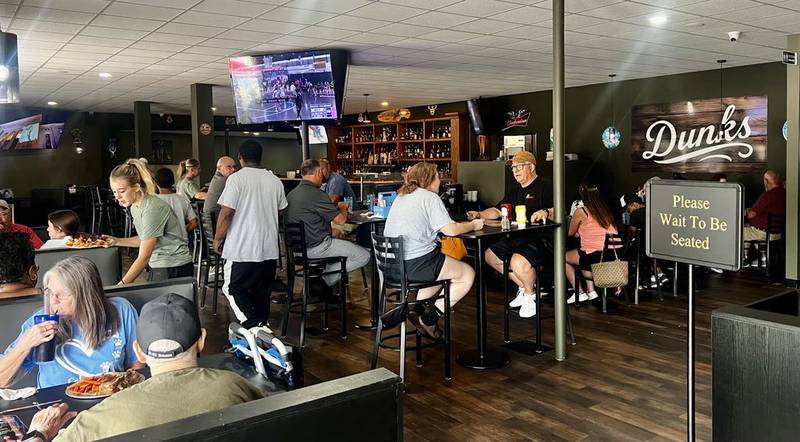 Hungry customers enjoy the food at Dunk's Bar & Grill in Dixon on July 21, 2025.