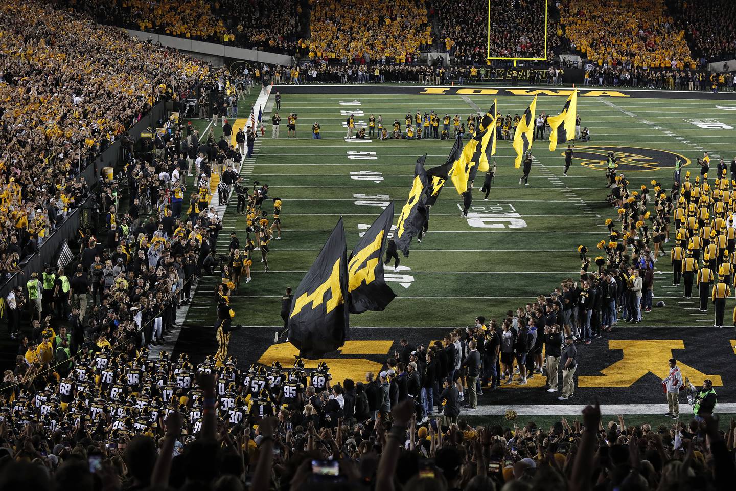 Iowa enters the field for the first half of an NCAA college football game against Wisconsin, Saturday, Sept. 22, 2018, in Iowa City. (AP Photo/Matthew Putney)