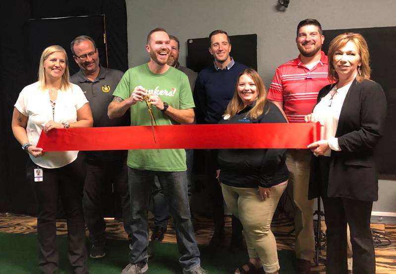 Bunkers Golf celebrates the opening of an indoor golf simulator with a ribbon cutting ceremony on Thursday, Oct. 13, 2022.