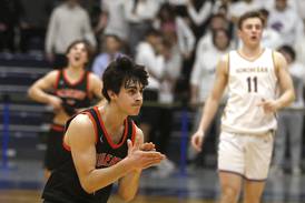 Boys basketball: McHenry holds off Hononegah’s torrent of 3s to advance to sectional championship