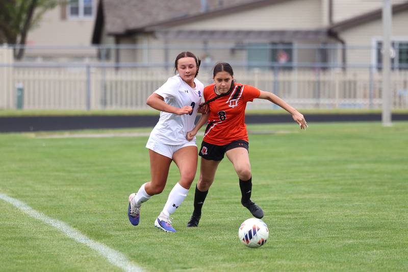Peotone's Bianei Marquez, left, and Beecher's Ruby Gomez battle for possession during Peotone's 2-1 victory over Beecher in the Class 1A Manteno Regional championship on Friday, May 22, 2026.