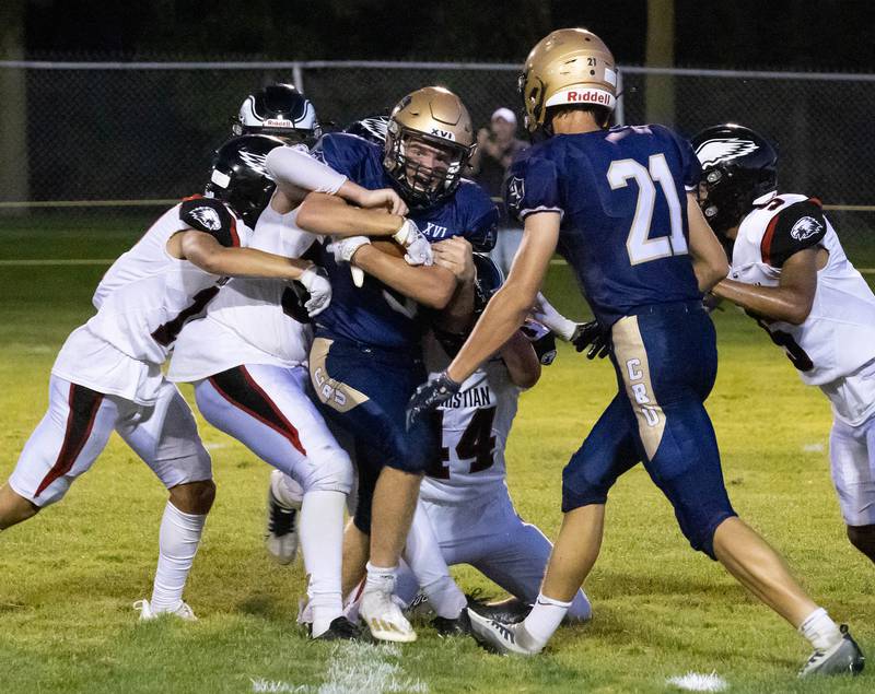 Marquette senior Tom Durdan advances a pass from Alex Graham in the second quarter, setting up Graham for a 1-yard goal on Friday Aug. 26, 2022 at Gould Stadium in Ottawa.