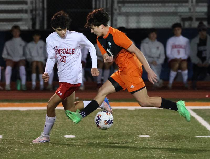 Hinsdale Central's Milan Puri and Hersey's Johnny Antoniou try to make a play on the ball Friday, Nov. 8, 2024, during their Class 3A state semifinal game at Hoffman Estates High School.