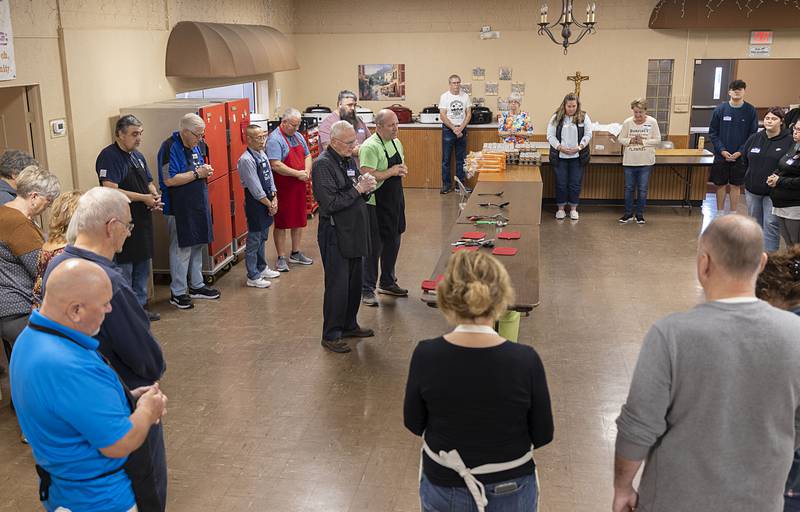 Pastor Leo Patterson of St. Paul’s Church in Dixon leads a prayer at the start of the Thanksgiving meal distribution Thursday, Nov. 24, 2022.