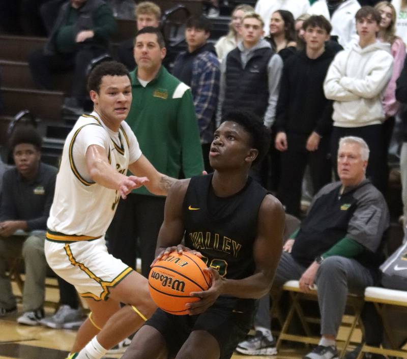 Crystal Lake South’s Cooper Buelna, left, guards Waubonsie Valley’s Tyreek Coleman during Hinkle Holiday Classic varsity boys basketball tournament title game action on Friday, Dec. 27, 2024 at Jacobs High School in Algonquin.