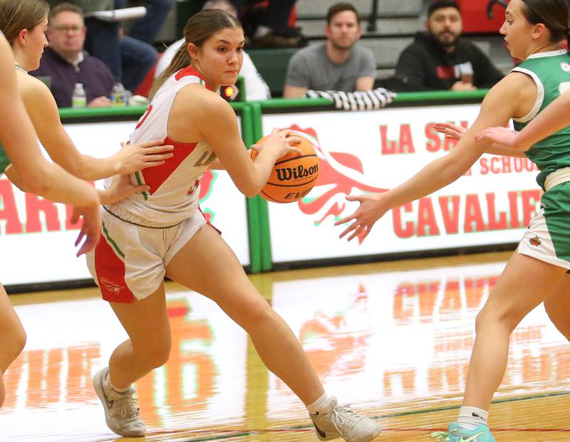 L-P's Phoebe Shetterly dribbles between Geneseo defenders on Tuesday, Feb. 4, 2025 in AJ Sellett Gymnasium at L-P High School.