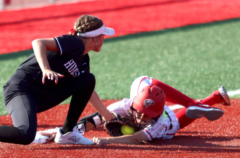 Huntley’s Grace Benson, left,  tags Barrington’s Liana Maggio out at third base in IHSA Class 4A Sectional Title Game softball action at the Fields of Dreams on the campus of Barrington High School in Barrington on Friday, June 6, 2025.