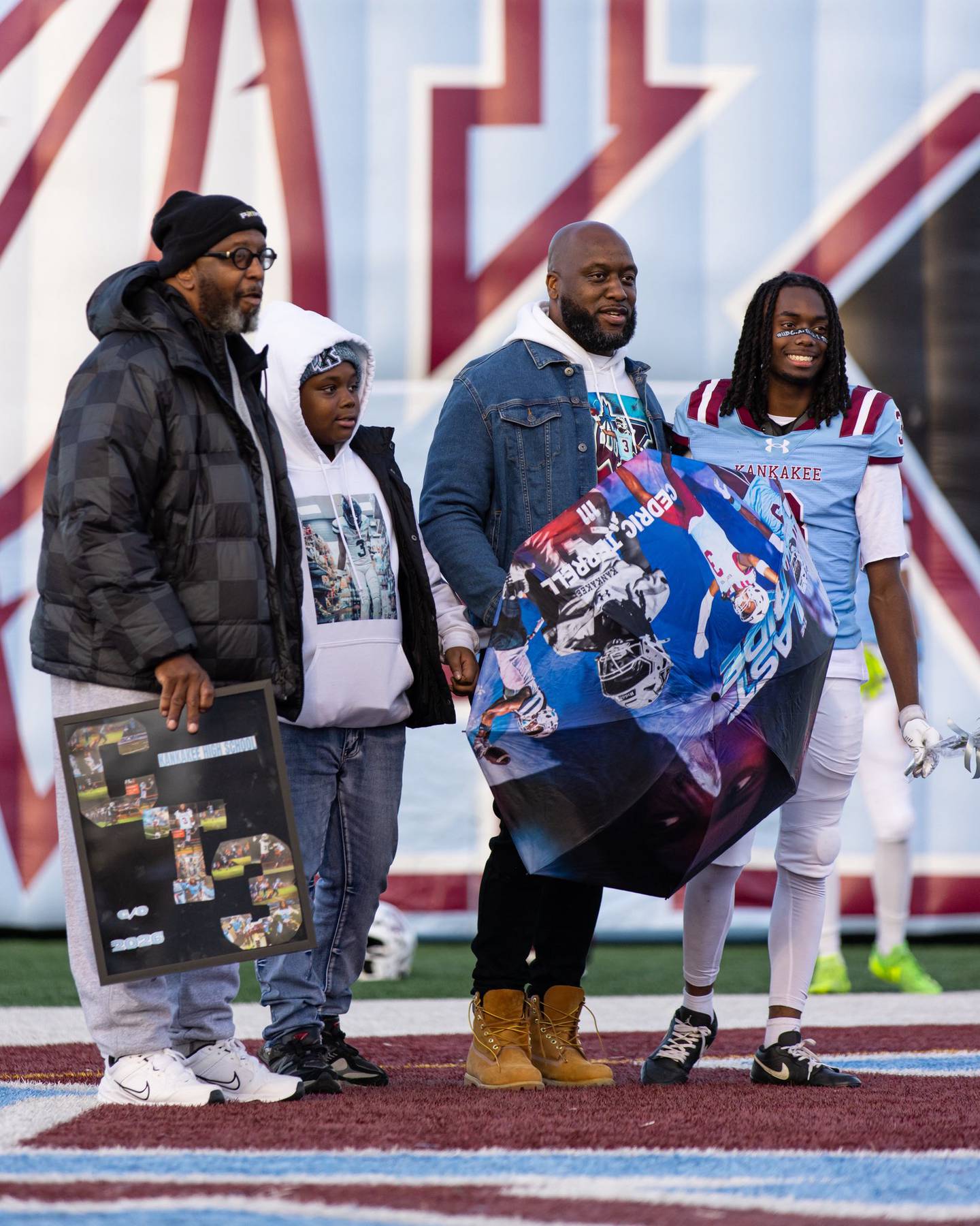 From left, Cedric Terrell Sr., Camron Terrell, Cedric Terrell Jr. and Cedric Terrell III stand together at Terrell III's Kankakee football senior night earlier this season.