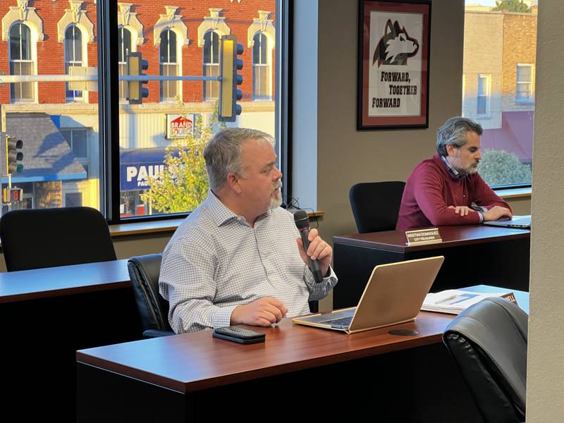 Sycamore Engineer Mark Bushnell talks, with Sycamore Finance Director Kristian Dominguez over his shoulder, on Oct. 7, 2024, to Sycamore City Council.