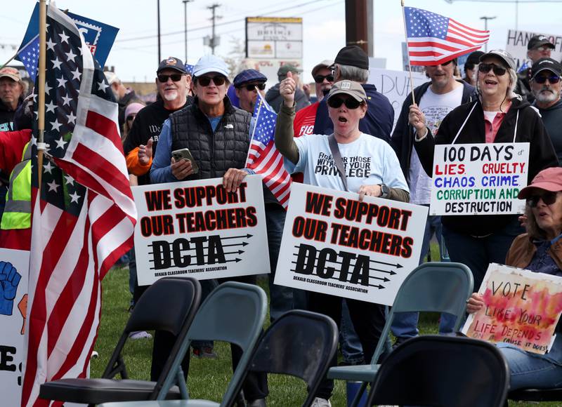 Protesters listens to speakers Saturday, May 3, 2025, at Hopkins Park in DeKalb during a May Day Rally for Democracy to protest against Trump administration policies.