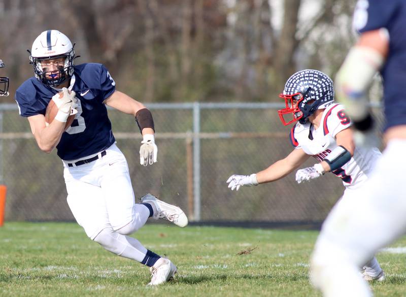 Cary-Grove’s  Preston Walsh runs the ball against Belvidere North in IHSA Class 6A quarterfinal playoff football action on Saturday, Nov. 16, 2024, at Al Bohrer Field on the campus of Cary-Grove High School in Cary.