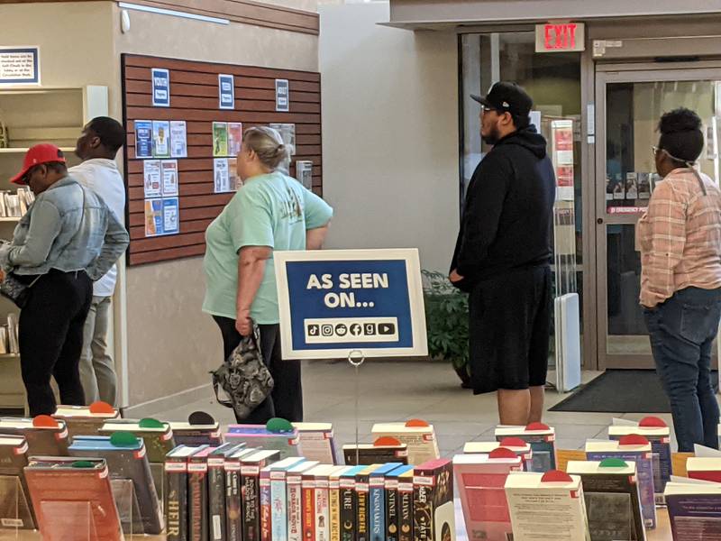 People wait to vote on Election Day at the  at the Montgomery campus of the Oswego Public Library.