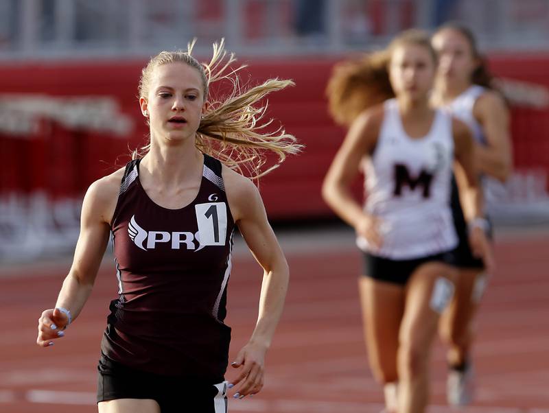 Prairie Ridge’s Rachel Soukup cruise to victory in the 3200 meter run Friday, May 5, 2023, during the Fox Valley Conference Girls Track and Field Meet at Huntley High School.