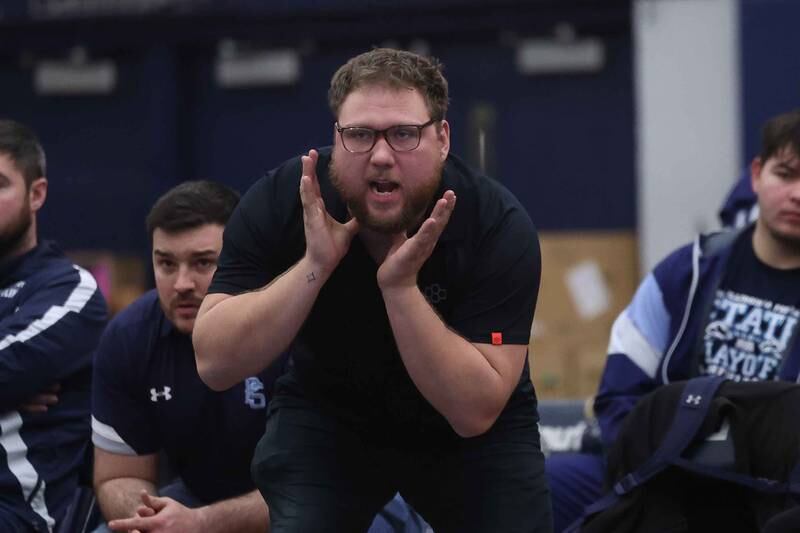 Plainfield South head coach yells out to his wrestler during a match against Joliet West on Wednesday, Dec. 11, 2024 in Plainfield.