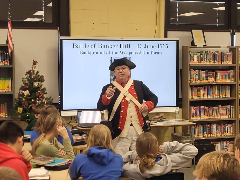 Dick Wells leads a Revolutionary War history lesson Wednesday, Dec. 20, 2023, at Logan Junior High School in Princeton.