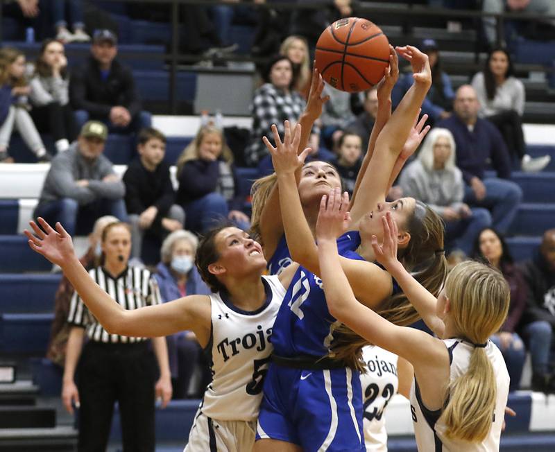 Cary-Grove's Morgan Haslow, Burlington Central's Samantha Origel ,Burlington Central's Haley Lindquist and Cary-Grove's Aubrey Lonergan battle for a rebound during a Fox Valley Conference girls basketball game Friday Jan. 6, 2023, at Cary-Grove High School in Cary.