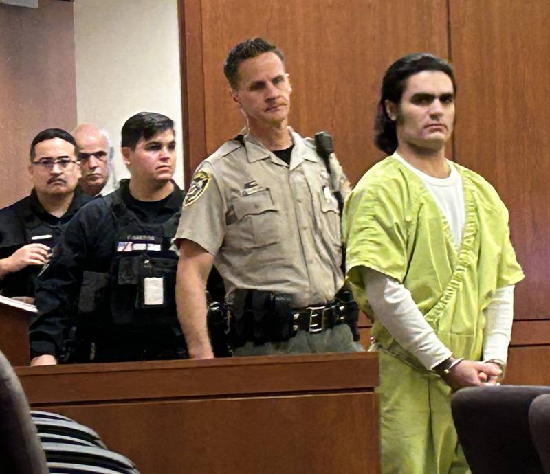 Jonathon Gounaris (right) is escorted into an Ogle County courtroom in Oregon on Thursday, Oct. 17, 2024. He is charged with the attempted murder of three law enforcement officers during an incident in rural Dixon in June. Gounaris is being held in the Winnebago County Jail as his case proceeds through the court system.