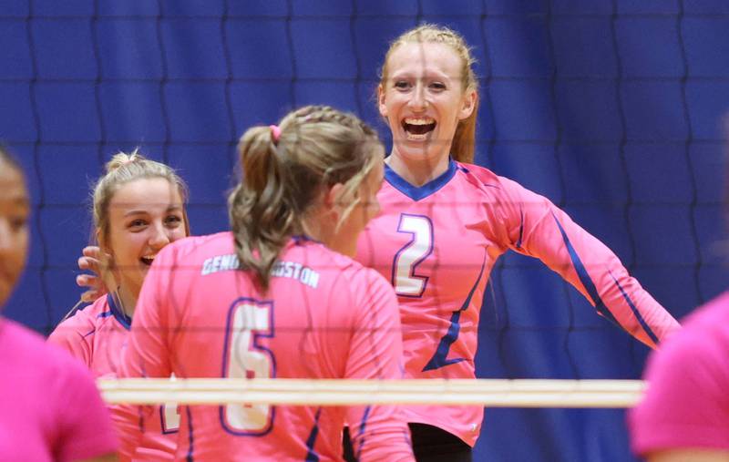 Genoa-Kingston players celebrate a point during their Volley for the Cure match against Oregon Wednesday, Sept. 21, 2022, at Genoa-Kingston High School.