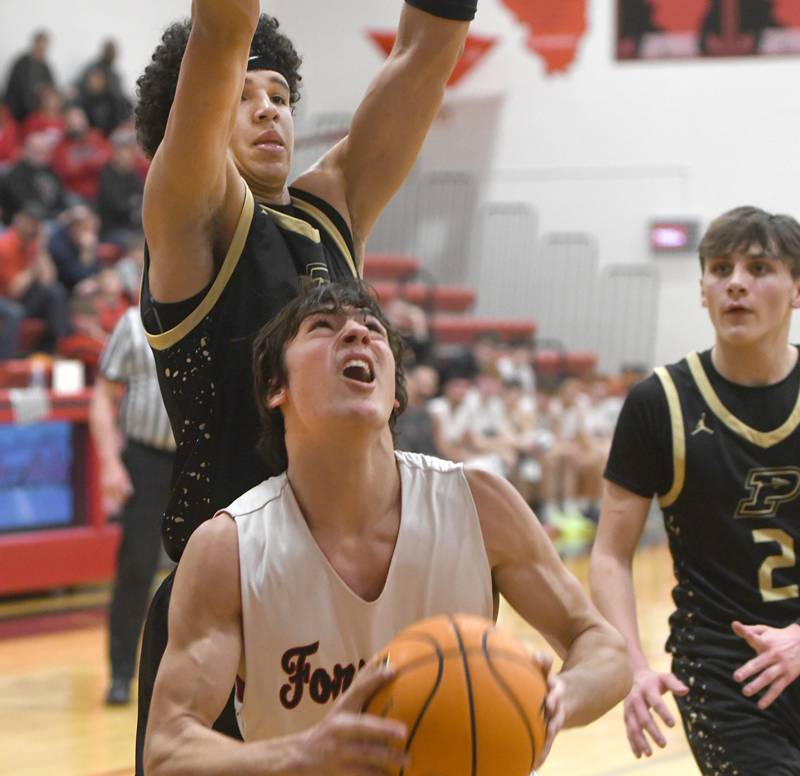 Forreston's Jonathan Milnes looks to the basket after snaring a rebound against Pecatonica on Wednesday, Feb. 11, 2026.