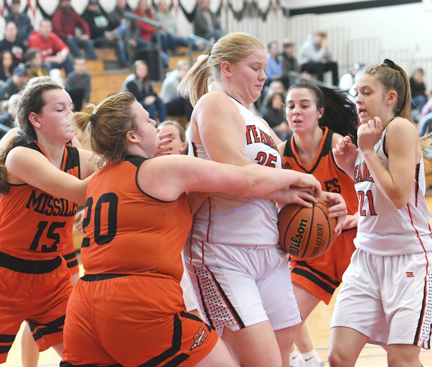 Fulton's Kylie Smither (35) and Lara Bieleman fight for the ball with Milledgeville's Lilianna Smith and Brooklyn Baslsiger during Saturday 1A regional action in Fulton.