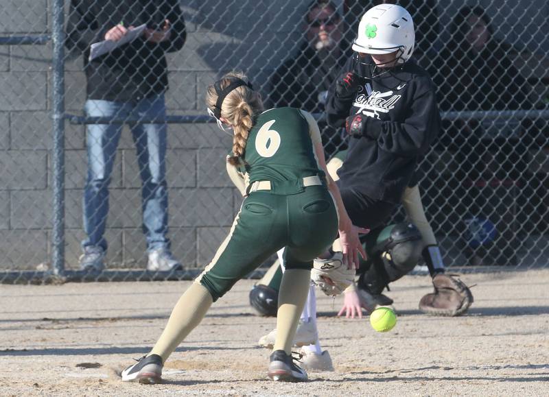 Woodland/Flanagan-Cornell's Olivia Chrismarick scores a run as St. Bede's Chipper Rossi catches the late throw at the plate on Tuesday, April 8, 2025 at Woodland High School.