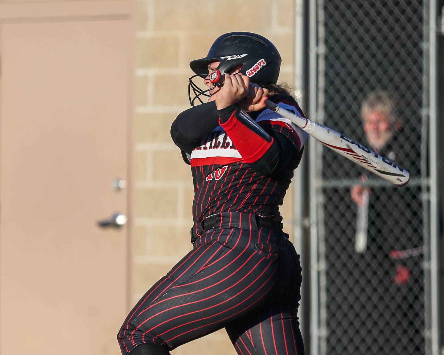 Yorkville's Kayla Kersting (10) smashes a hit during softball game between Benet at Yorkville.  April 5th, 2024.