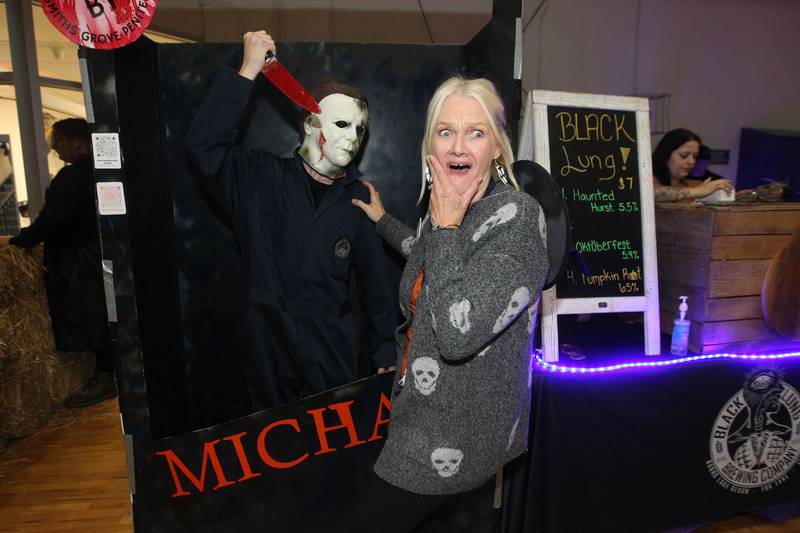 Michael Myers, of Grayslake has some fun with Kathy Kohler, of Lindenhurst, director of marketing, play acting during Witchy Thrills & Chills at the Lindenhurst Park District Lippert Community Center on October 14th in Lindenhurst. The scary scene was sponsored by the Black Lung Brewing Company.
Photo by Candace H. Johnson for Shaw Local News Network