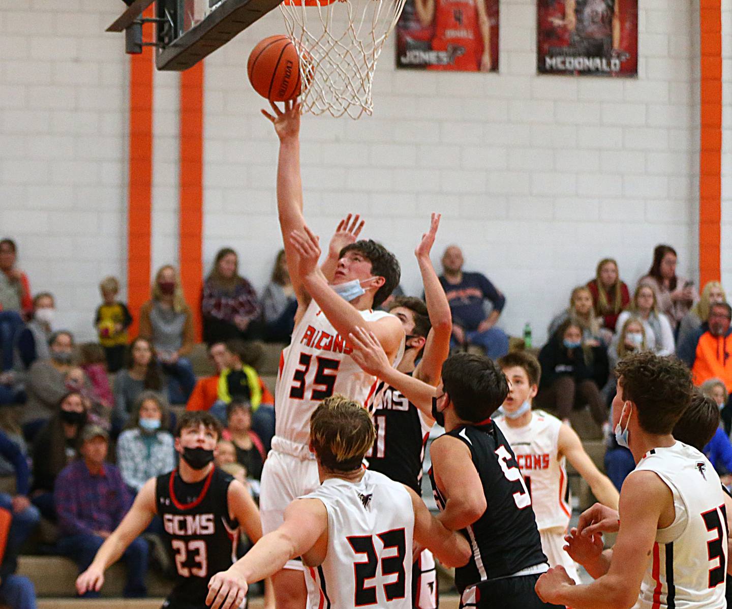 Flanagan-Cornell's Kesler Collins (35) pulls up in the lane to shoot over the Gibson City-Melvin-Sibley defense during a game on Friday, Dec. 3, 2021, in Flanagan.