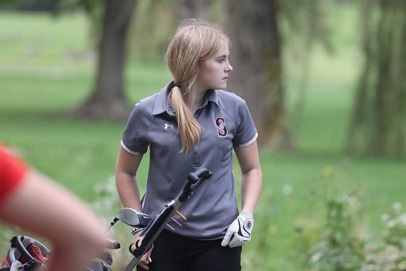 Streator’s Lillianna Negray watches her group partner tee off hole 1 in the Class 2A Bradley Regionals at the Green Garden Country Club in Frankfort on Thursday, Sept. 28, 2023.