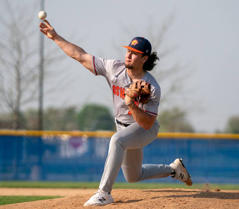 Oswego’s Jordan Logan (22) delivers a pitch against Oswego East during a baseball game at Oswego East High School on Tuesday, May 10, 2022.