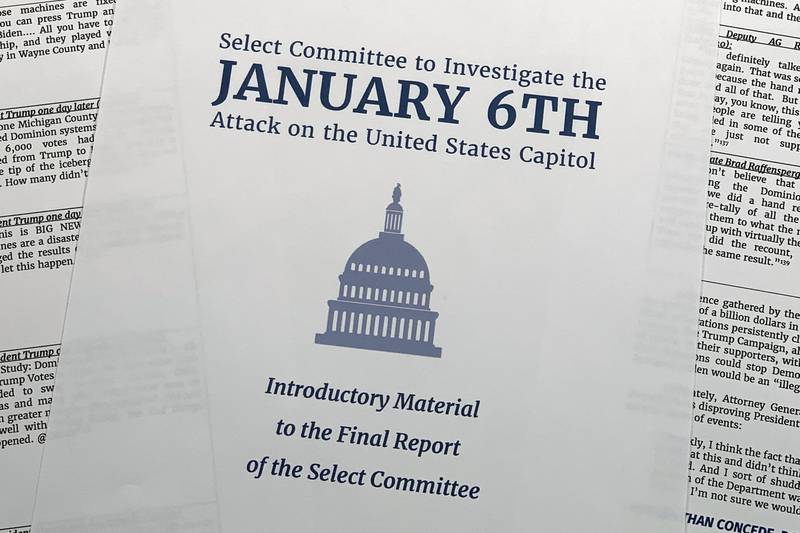 FILE - Pages of the executive summary from the House select committee investigating the Jan. 6 attack on the U.S. Capitol, are photographed Monday, Dec. 19, 2022, in Washington. (AP Photo/Jon Elswick, File)