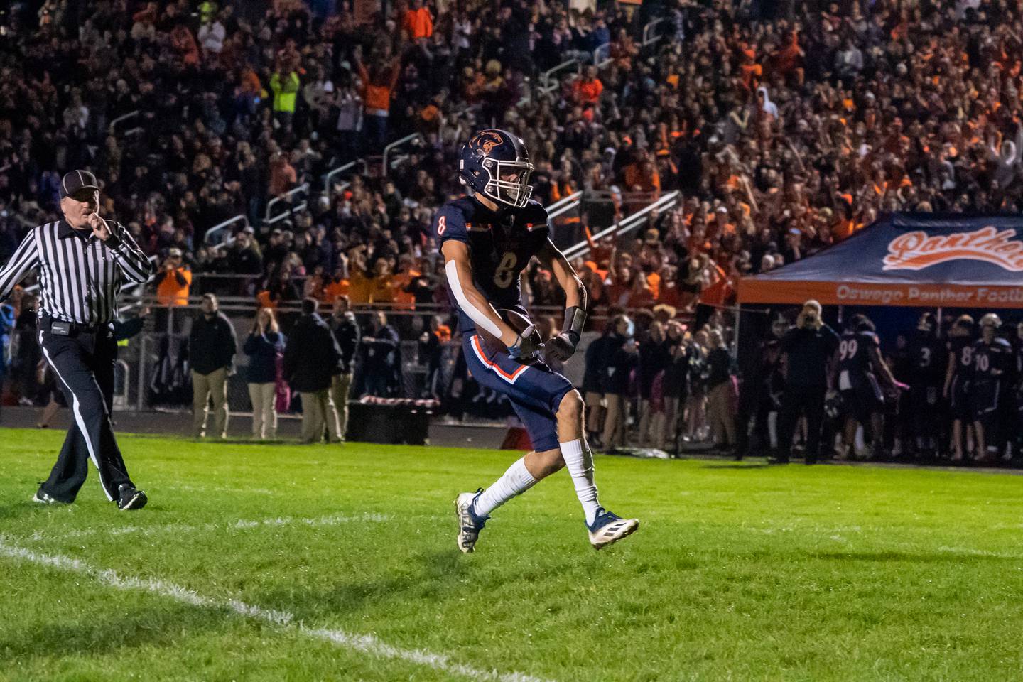 Oswego’s Connor Deal (8) celebrates after scoring on a reception against Oswego East during a high school football game at Oswego High School in Oswego on Friday, Oct 15, 2021.